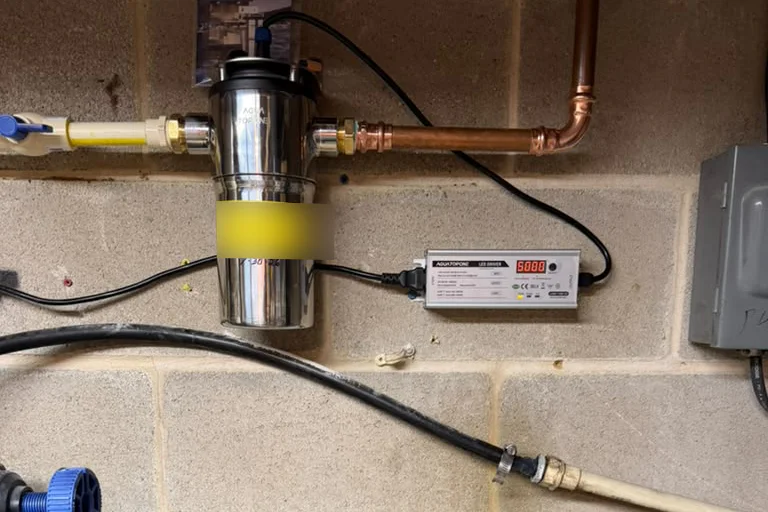AGLED-40012 whole-house UVC LED reactor installed on copper plumbing in the United States